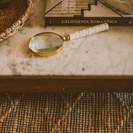 A book of California Mission and Spanish colonial style architectural design on a coffee table