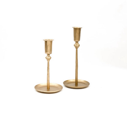 Brass taper candle holder displayed in small and large sizes.
