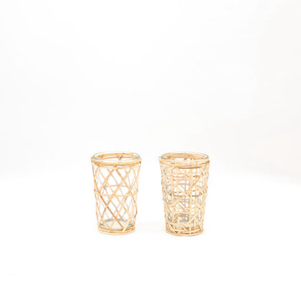 Two recycled glassware, sheathed in interlaced rattan, displayed displaying different rattan patterns.
