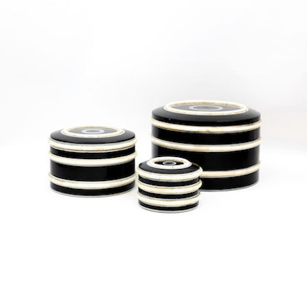 Round, black box with horizontal white stripes. Shown in three sizes.