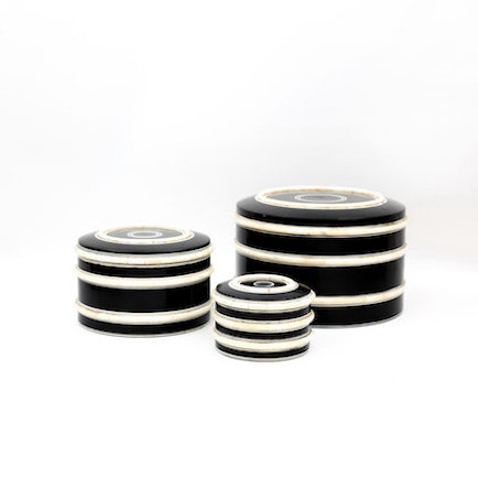 Round, black box with horizontal white stripes shown with three available sizes.
